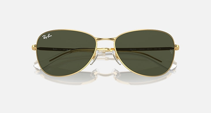 Gold-tone aviator sunglasses with dark green-to-black gradient lenses