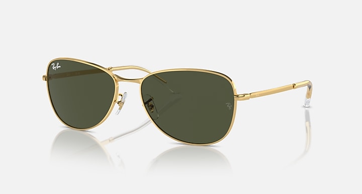 Gold-tone aviator sunglasses with dark green lenses and gradient tint