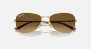 Gold-tone aviator sunglasses with dark brown gradient lenses and brown temples