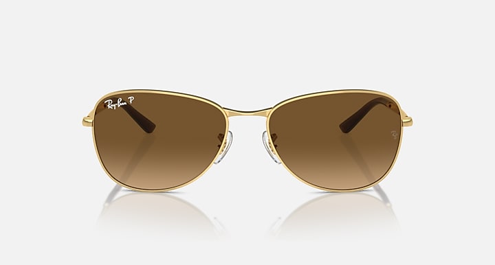 Gold-tone aviator sunglasses with brown lenses and subtle gradient tint