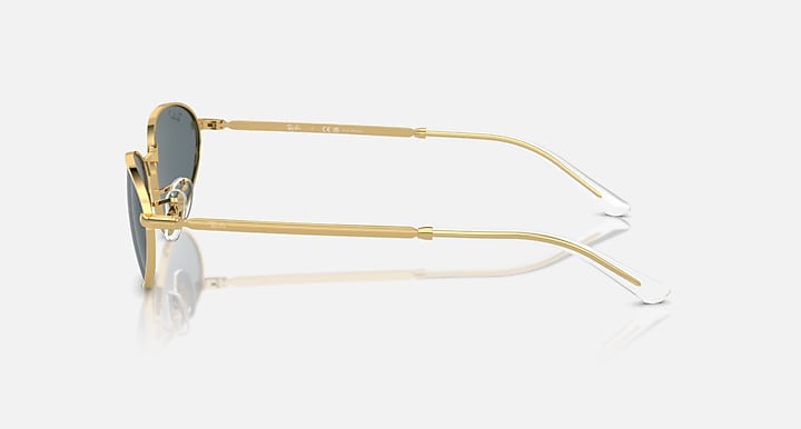 Gold metal sunglasses, side profile, clear lenses with visible hinges