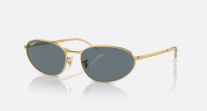 Gold metal round sunglasses with dark gray lenses and clear temples