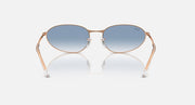 Gold-tone oval sunglasses with blue gradient lenses and metal bridge