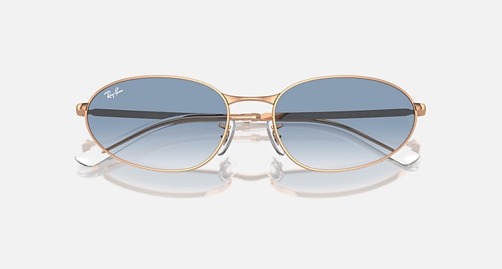 Gold-tone sunglasses with dark blue lenses and reflective gradient tint