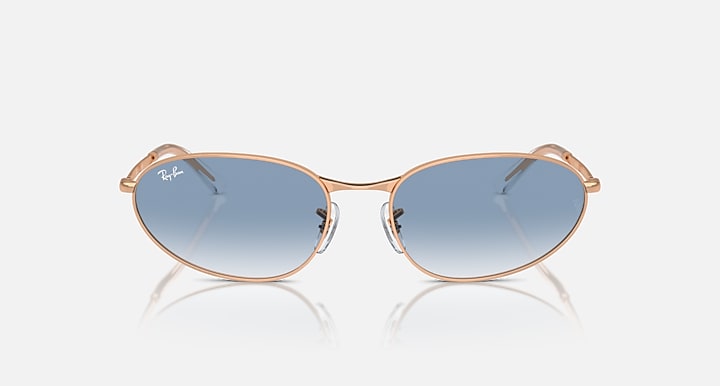 Gold-tone sunglasses with blue gradient oval lenses and thin metal frame