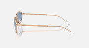 Gold-tone sunglasses side view with blue tinted lenses and clear temples