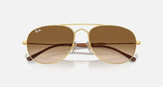 Gold oval sunglasses with brown gradient lenses and front bridge hardware