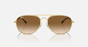 Gold oval sunglasses with brown gradient lenses and slim keyhole bridge