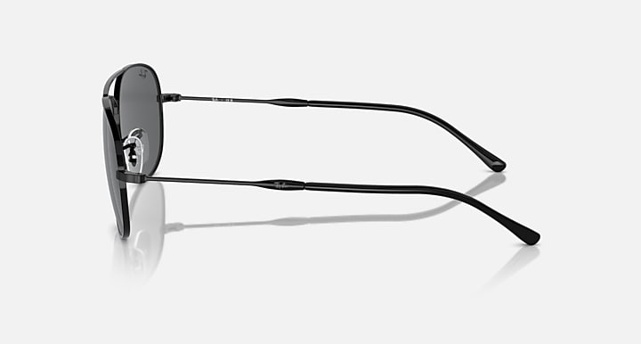 Ray-Ban metal sunglasses shown in side profile with dark gray lens and thin temples