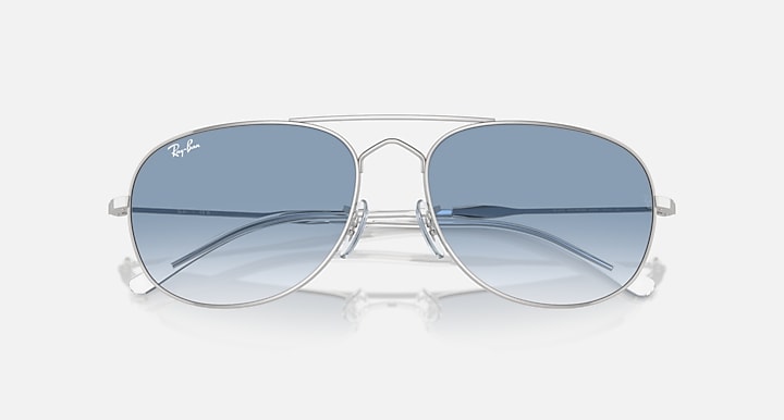 Ray-Ban metal sunglasses with light blue gradient lenses and slim silver bridge, front