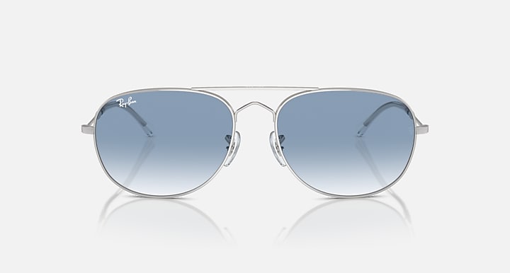 Ray-Ban metal sunglasses with light blue gradient lenses and thin silver frame, front