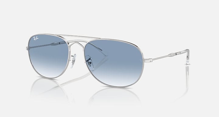 Ray-Ban metal sunglasses with light blue gradient lenses and clear bridge and temples