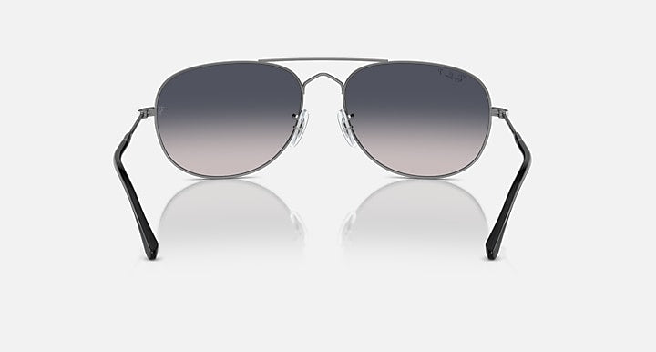 Ray-Ban aviator-style sunglasses with dark frame and smoky gradient lenses
