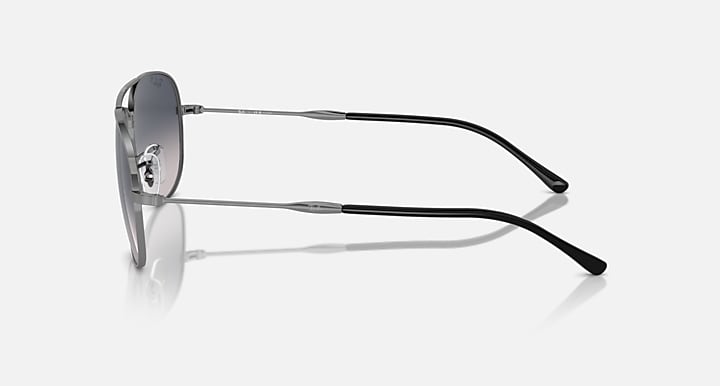 Ray-Ban aviator-style sunglasses side view with silver frame and dark lenses
