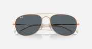 Ray-Ban aviator-style sunglasses with rose-gold frame and dark tinted lenses