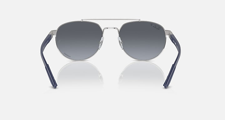 Ray-Ban sunglasses with dark lenses and blue frame, metal bridge detail