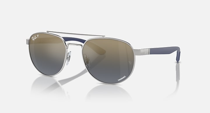 Ray-Ban sunglasses with silver frame, navy temples, dark gradient mirrored lenses