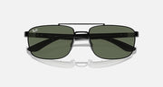 Sunglasses top view with dark green lenses and black rectangular frame