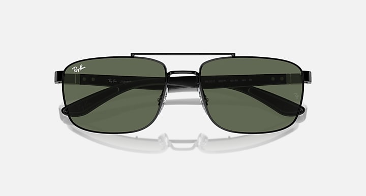 Sunglasses top view with dark green lenses and black rectangular frame