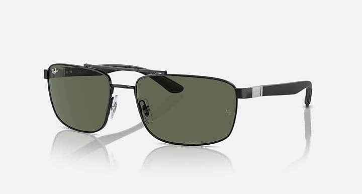 Sunglasses with dark green lenses and black rectangular frame with silver accents