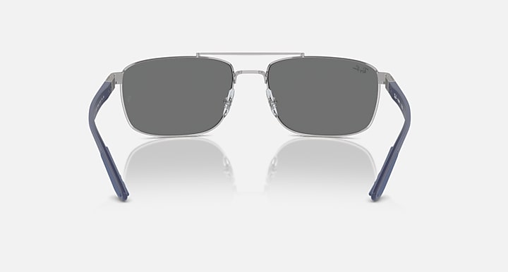 Sunglasses front view with grey lenses and blue-accented frame
