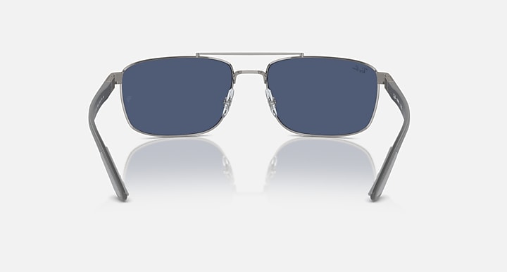 Rectangular metal sunglasses with dark lenses and silver frame, front view on white