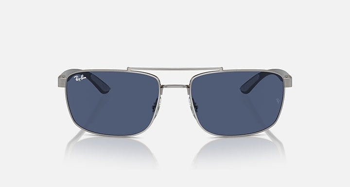Rectangular metal sunglasses with dark blue lenses and silver bridge, front view
