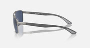 Rectangular metal sunglasses with dark tinted lenses and curved temple arms, side view