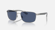 Rectangular metal sunglasses with dark tinted lenses and silver frame, side view