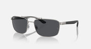 Rectangular metal sunglasses with dark tinted lenses and black-tinted temple tips, side view