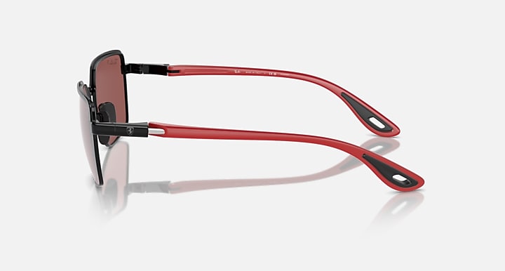 Side view of square sunglasses with dark frames, rose mirrored lenses, red temples