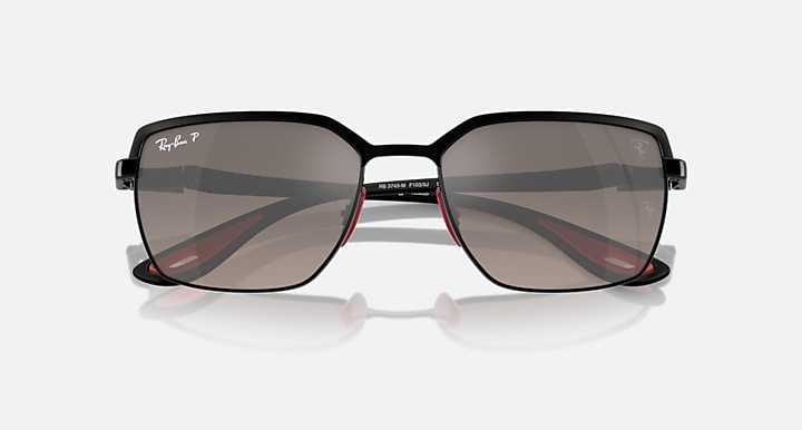 Close front view of square sunglasses with black frames and smoky mirrored lenses