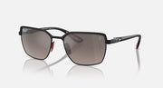Square sunglasses with black frames, smoked lenses, and red temple tips
