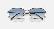 Sunglasses with blue lenses, silver frame, tortoise brown diagonal temple details