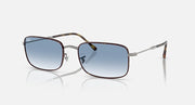 Square sunglasses with dark blue lenses, silver frame and tortoise brown temples