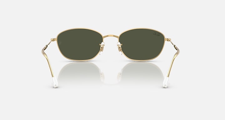 Gold oval sunglasses with dark green lenses and adjustable metal nose pads