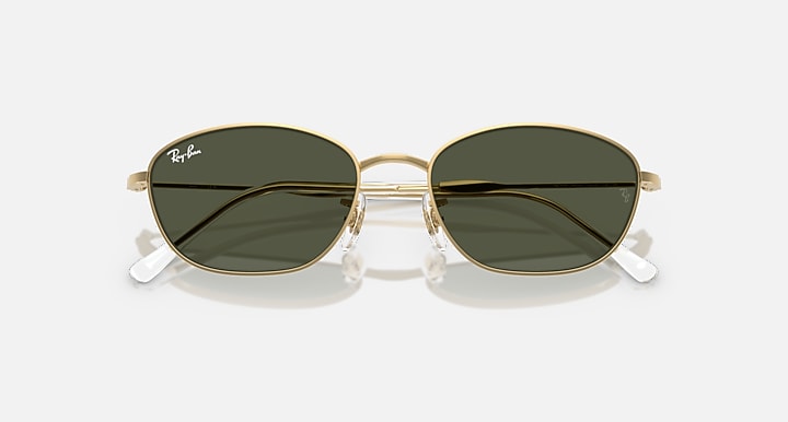 Gold oval sunglasses with dark green lenses and silver-tinted temple tips