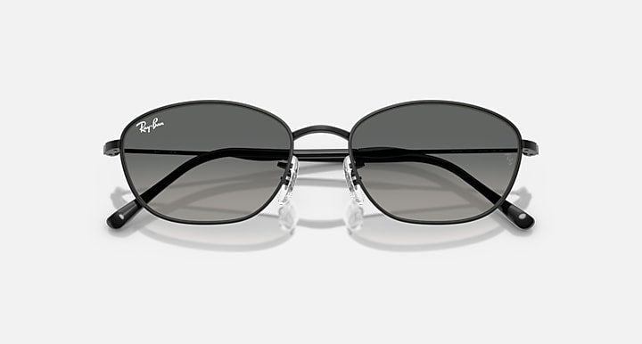 Sunglasses with dark lenses and black metal frames, thin oval shape.