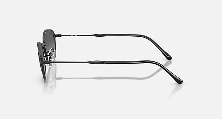 Sunglasses with dark gray lenses and black metal frames, side view.