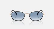 Sunglasses with blue tinted lenses and rose-gold/black metal frames, front view.