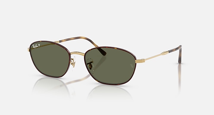 Ray-Ban oval sunglasses with gold metal frame and dark green lenses