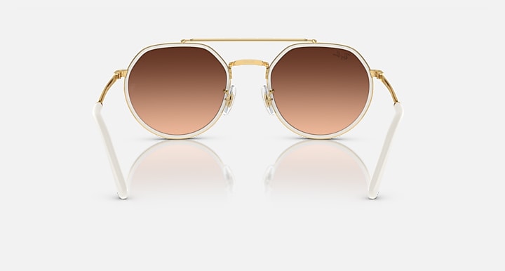 Ray-Ban round sunglasses with gold frame and warm brown gradient lenses