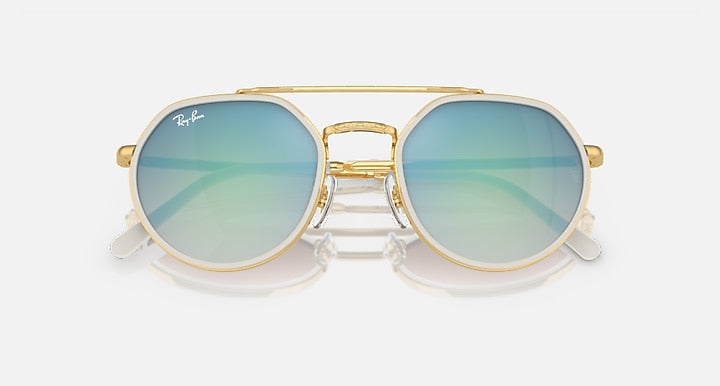 Ray-Ban round sunglasses front view, gold frame with light blue mirrored lenses