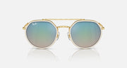 Ray-Ban round sunglasses with gold frame and sky-blue gradient lenses