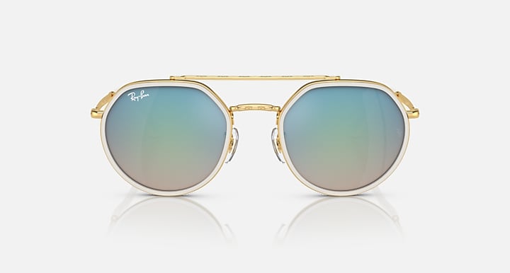 Ray-Ban round sunglasses with gold frame and sky-blue gradient lenses