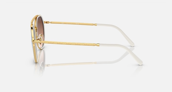 Ray-Ban round sunglasses side view, gold metal frame with teal lenses