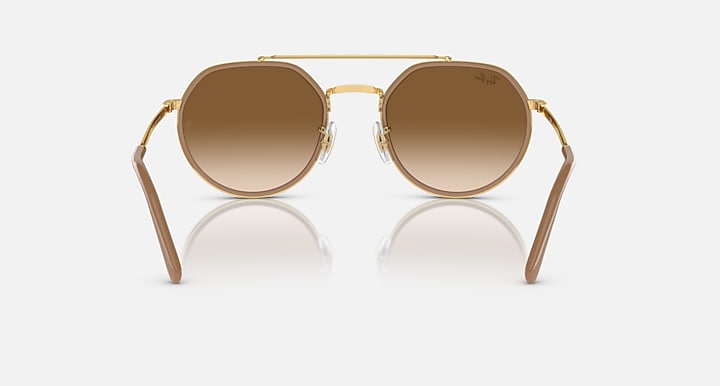 Ray-Ban round sunglasses front view, gold frame with medium brown lenses