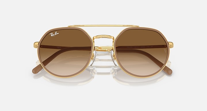 Ray-Ban round sunglasses front view, gold frame with dark brown mirrored lenses