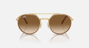 Ray-Ban round sunglasses front view, gold frame with dark brown tinted lenses