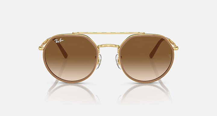Ray-Ban round sunglasses front view, gold frame with dark brown tinted lenses